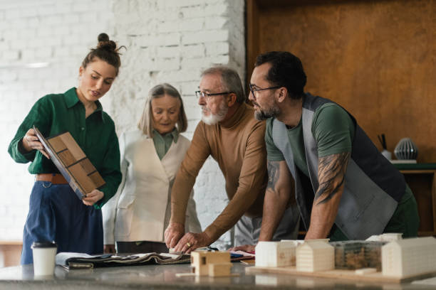 istock Young architects designing house for seniors client. 1491683468