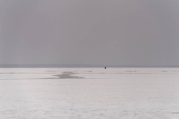 istock Two young people skating on lake at dusk. 149168538