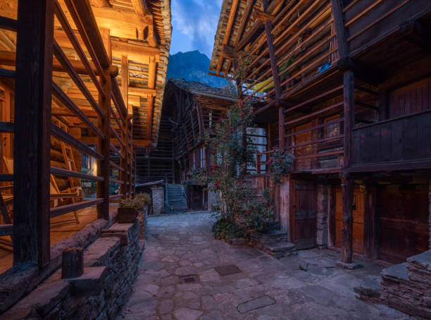 The rural architecture of Alagna village in the Valsesia valley range at dusk - Italy. The rural architecture of Alagna village in the Valsesia valley range at dusk - Italy. alagna stock pictures, royalty-free photos & images