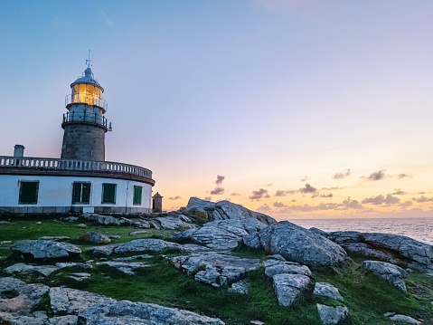 Corrubedo Cape and Lighthouse\nRegion of Barbanza, GALICIA, PROVINCE OF A CORUÑA, RIBEIRA / Capes, Lighthouses\nThe westernmost point of the Barbanza Peninsula is Cabo Corrubedo. It is located very close to the dunes of the same name and is characterized by being a rocky area with low scrub and small cliffs, although extremely harsh in terms of the forces of the sea, due to its latitude above the ocean, since this This point is one of the westernmost in the Rías Baixas.