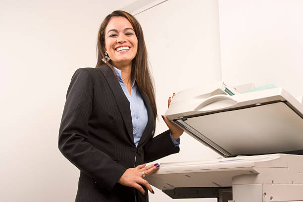 istock Pretty businesswoman making copies 149168972