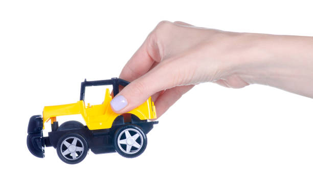 istock Yellow toy car in hand 1491690304
