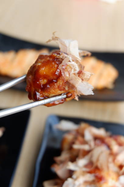 istock Take takoyaki with katsuobushi topping using chopsticks 1491690440