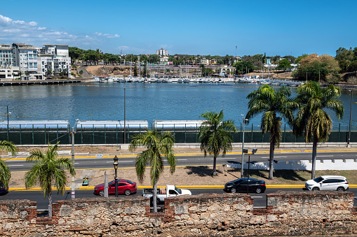 Santo Domingo, Dominican Republic - March 30, 2023 -  A scenic view of the Colonial City ruins along the Obama River in in Santo Domingo, the Dominican Republic.