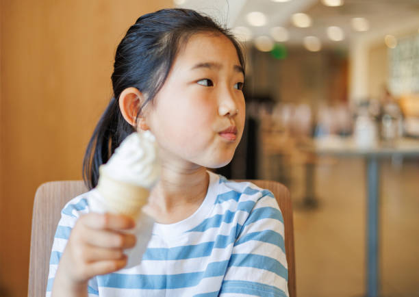 istock Little Girl Eating Ice Cream 1491692503