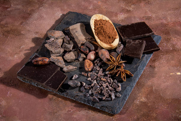 istock Black chocolate tablet chopped on a slate slab. 1491692569