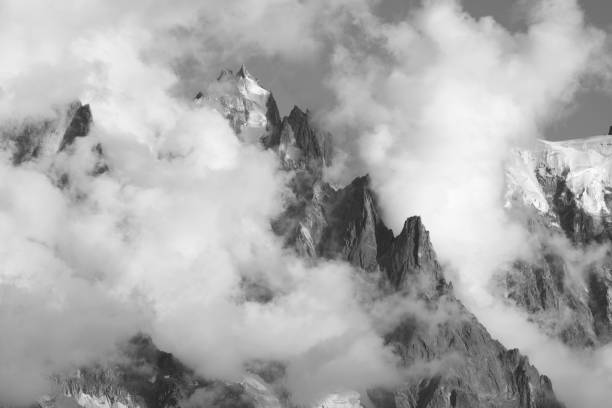 istock The peak Aiguille du Plan in the clouds - Chamonix - Mont Blanc massif. 1491692573