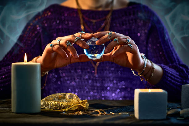 istock Witch woman using enchanting elixir potion bottle for love spell, magical witchcraft and divination. Magic and alchemy 1491698629