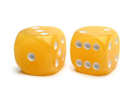 Two amber dice on white background