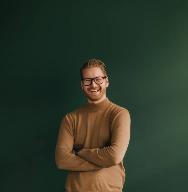 a happy handsome blond businessman with glasses looking at camera - business men humor macho imagens e fotografias de stock