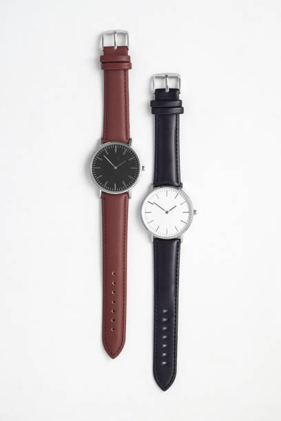 istock Watches with brown and black leather strap on white office desk 1491701611
