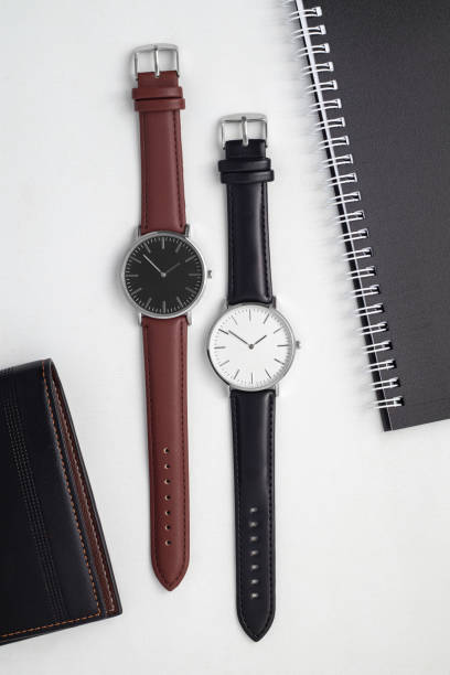 istock Watches with brown and black leather strap on white office desk 1491702436