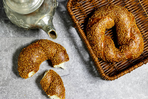 istock Traditional turkish breakfast with simit bagels in basket with teapot 1491706160