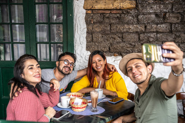 istock Friends taking a selfie or filming at a coffee shop 1491709306