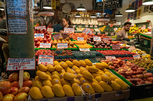Seattle, WA - June 2022: Fresh produce displayed for sale in one of the many shops at Pike Place Market in Seattle.