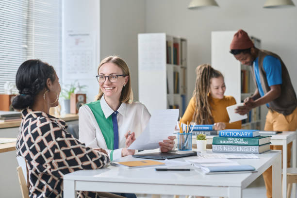 istock Teacher speaking English with student 1491716885