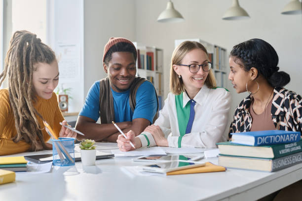 istock Students talking to teacher at lesson 1491716899