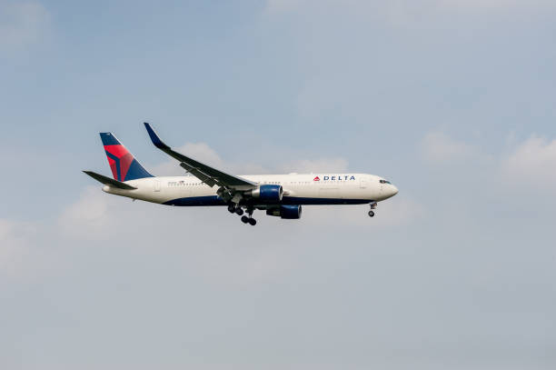 Delta Air Lines Airlines Boeing 767 N1200K landing in London Heathrow International Airport. London, England - September 27, 2017: Delta Air Lines Airlines Boeing 767 N1200K landing in London Heathrow International Airport. delta stock pictures, royalty-free photos & images