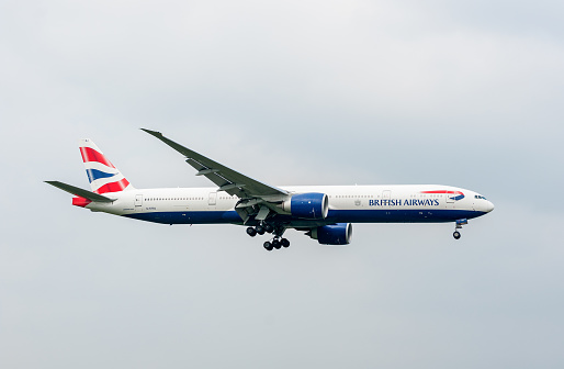London, England - September 27, 2017: British Airways Airlines Boeing 777 G-STBJ landing in London Heathrow International Airport.