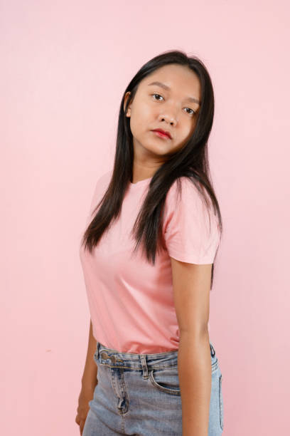 istock Beautiful young girl smiling standing on pink background. 1491717805