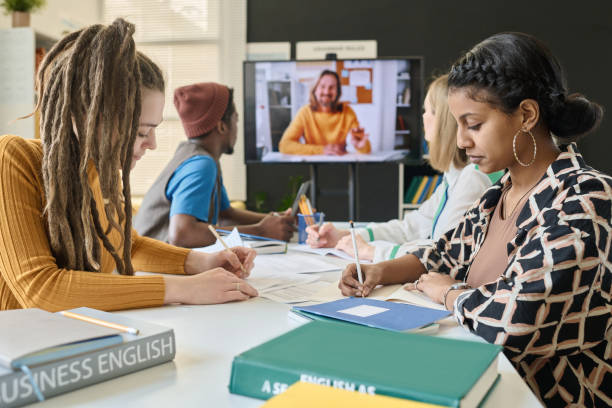 istock Group of students having video call with teacher 1491717941