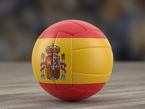 Volleyball ball Spain flag on a wooden floor. 3d illustration.