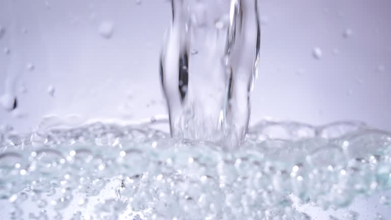 Pouring purity water on white background