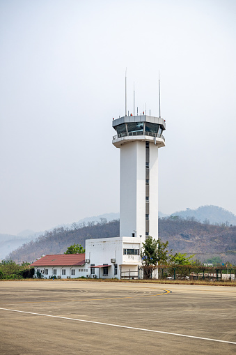 Luang Prabang Airport, Laos - March 10th 2023:  The control tower standing beside the low building