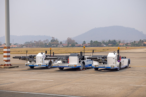 Luang Prabang Airport, Laos - March 10th 2023: Three conveyor belts for loading and unloading luggage in an airport
