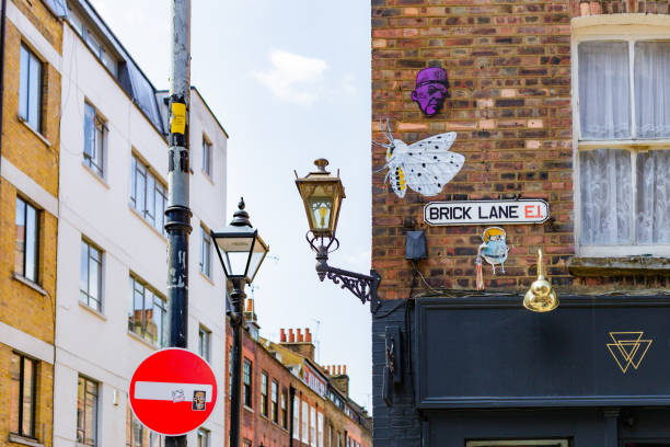 London, UK - 16 May, 2023 Brick Lane in east London, UK. The area has a large immigrant population and is famous for its Indian and Bangladeshi curry houses.