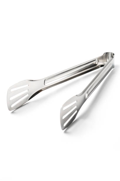 istock Stainless steel kitchen tongs isolated on white background 1491728850
