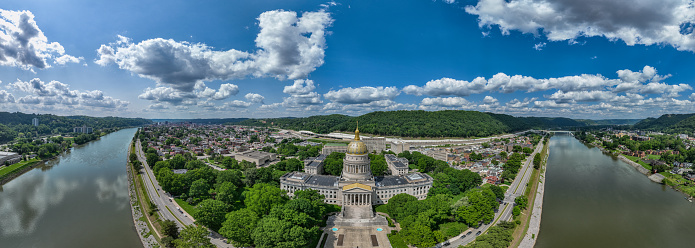 The 293-foot gold atop the capitol is five feet taller than the dome of the United States Capitol.  The dome is covered in copper and gold leaf. The dome was originally gilded by Mack Jenney and Tyler Company in 1931. The dome was restored to the original plans of Cass Gilbert in 2005, which included the reconstruction of the eagle at the top of a 25-foot bronze spire built on a 34 and a half-foot lantern.
