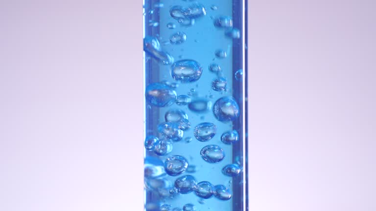 Blue liquid water splashing bubble in test tube