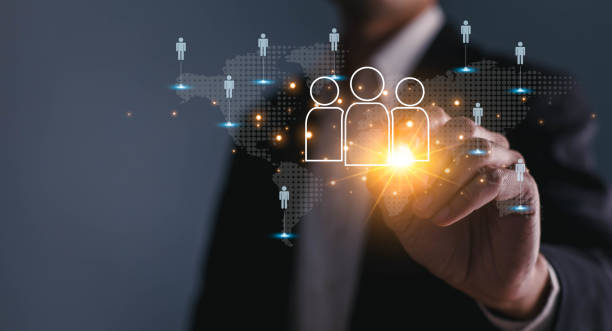 istock Businessman touching virtual human icon on world map for business CRM or Customer Relation Management and customer service concept by use social media technology. 1491738090