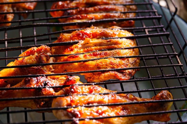 istock close-up. chicken steaks on a grill rack cooking over an open fire 1491740237