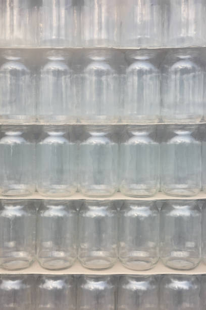Picture of packed and foiled new empty jars, selective focus.