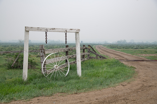 Old ranch entry way and dirt road on the Montana prairie in west USA of North America.