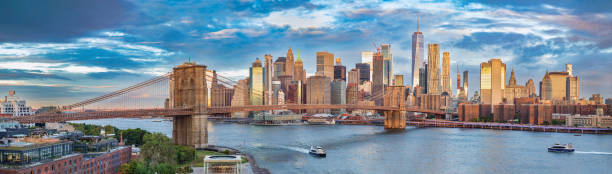 View of the Brooklyn Bridge, New York City. View of the Brooklyn Bridge and Lower Manhattan at sunrise, New York City. brooklyn bridge new york stock pictures, royalty-free photos & images