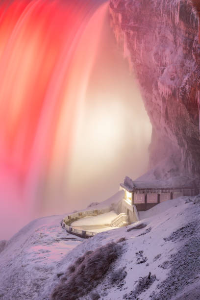 istock Frozen Niagara Falls lit up at night with snow and ice covering a viewing platform 1491752772
