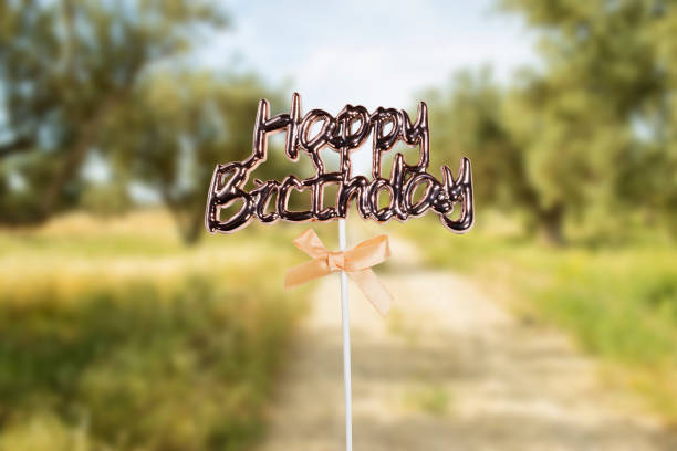 istock happy birthday  text concept near blurred olives field 1491753522