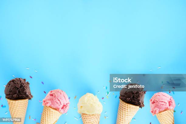 Ice Cream Bottom Border Over A Blue Background Stock Photo - Download Image Now - Ice Cream, Ice Cream Cone, Backgrounds