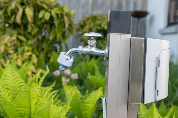 istock faucet or tap at garden with spring plant 1491763561