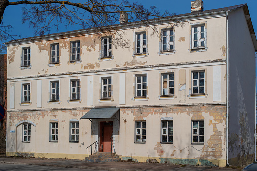 Narva, Estonia - April 11 2023: The abandoned building at Kiriku street in Narva city on a sunny spring day.