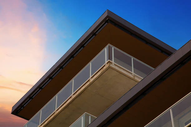building balconies corner on blue and pink dramatic sunset minimalist architecture residential city living