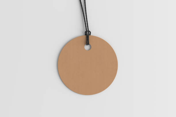 istock Cardboard round tag mockup on white background. View directly above 1491777879