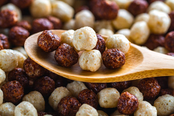 istock Cereals spoon with chocolate brown and white balls for dry breakfast close up 1491778718