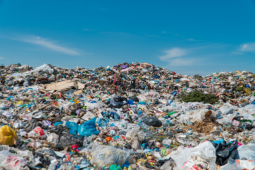 Garbage dump landscape. Open-air landfill. Ecological damage, contaminated land.