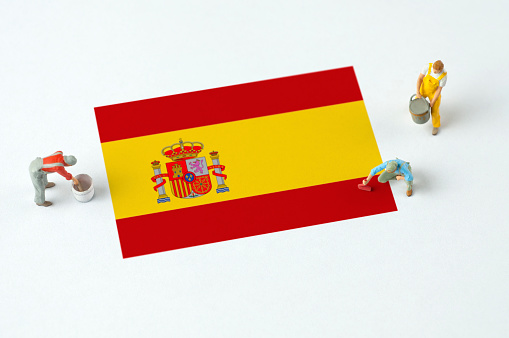 Painters paint the Spanish Flag