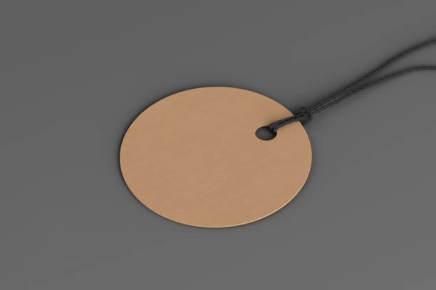 istock Cardboard round tag mockup on gray background. Side view 1491781489