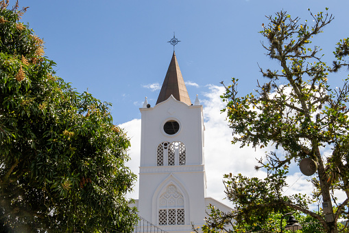 bell tower with a white tower in a town in Colombia